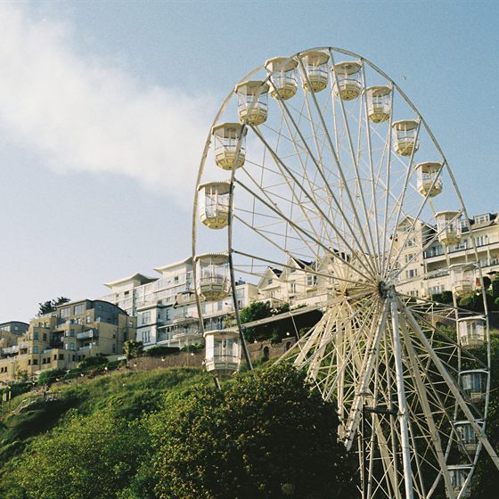 Library photo: a Ferris wheel above seaside houses